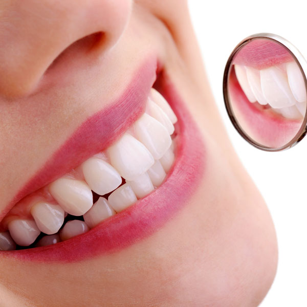 smiling teeth by mirror